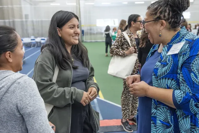 President Sarah Willie-LeBreton greets a new student at Central Check-In